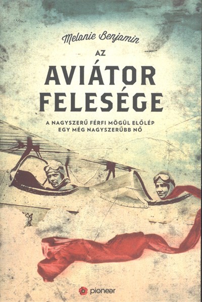 AZ AVIÁTOR FELESÉGE /A NAGYSZERŰ FÉRFI MÖGÜL ELŐLÉP EGY MÉG NAGYSZERŰBB NŐ